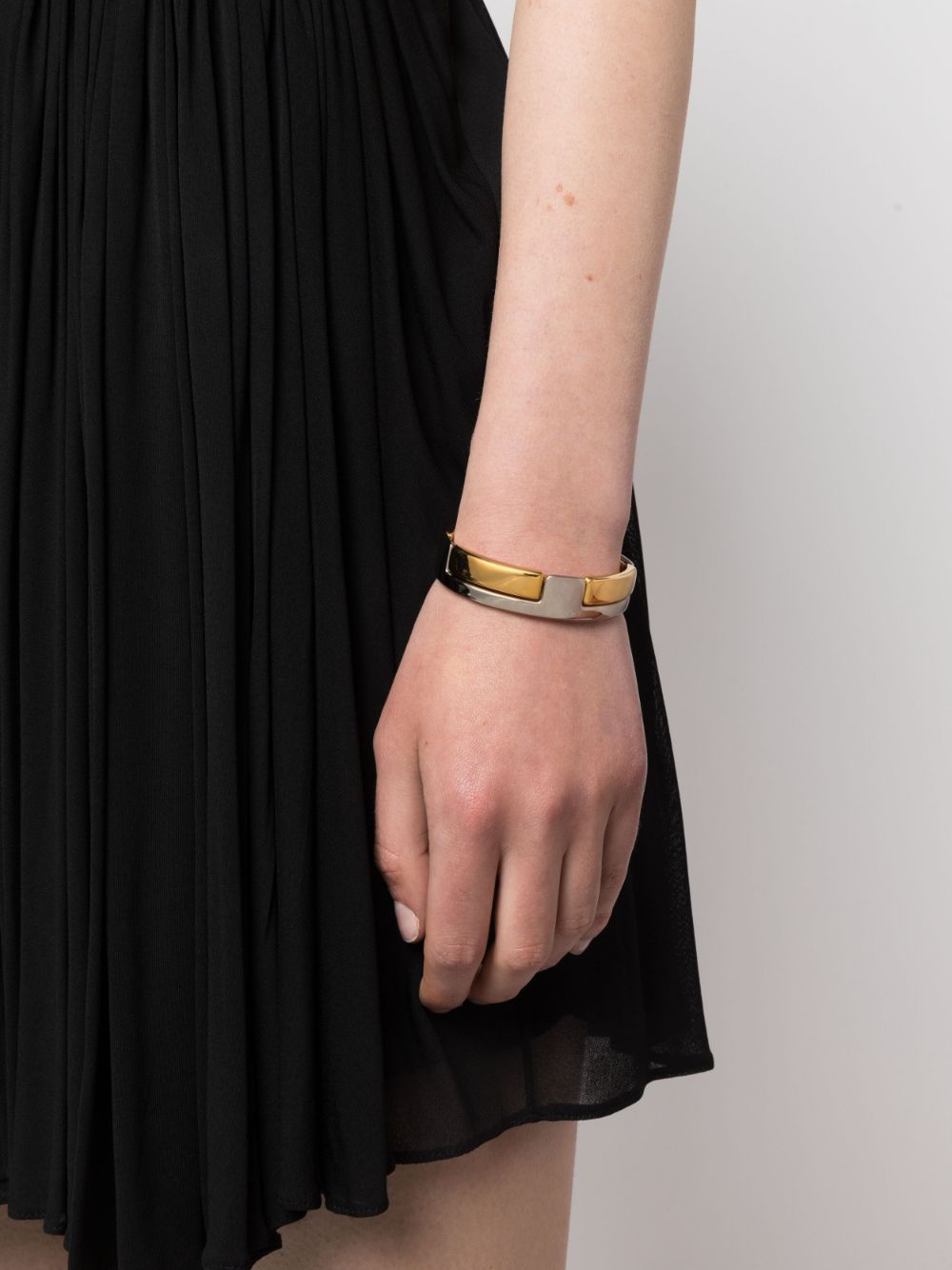 Shop Saint Laurent Polished-finish Circular-design Bracelet In Gold