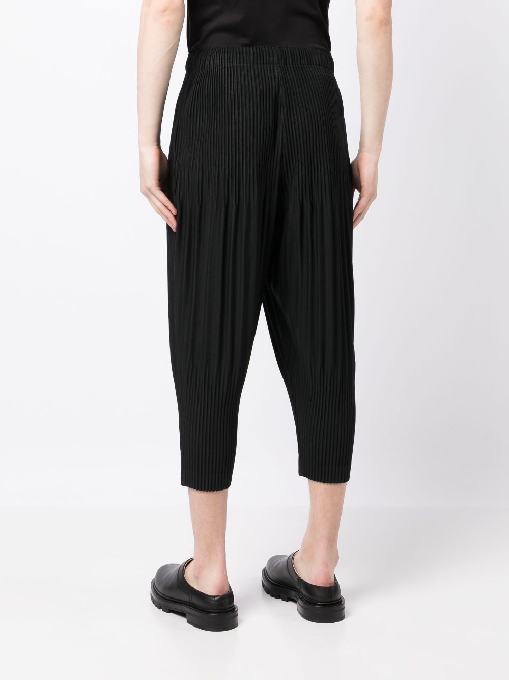 Shop Issey Miyake Plissé Cropped Drop-crotch Trousers In Black