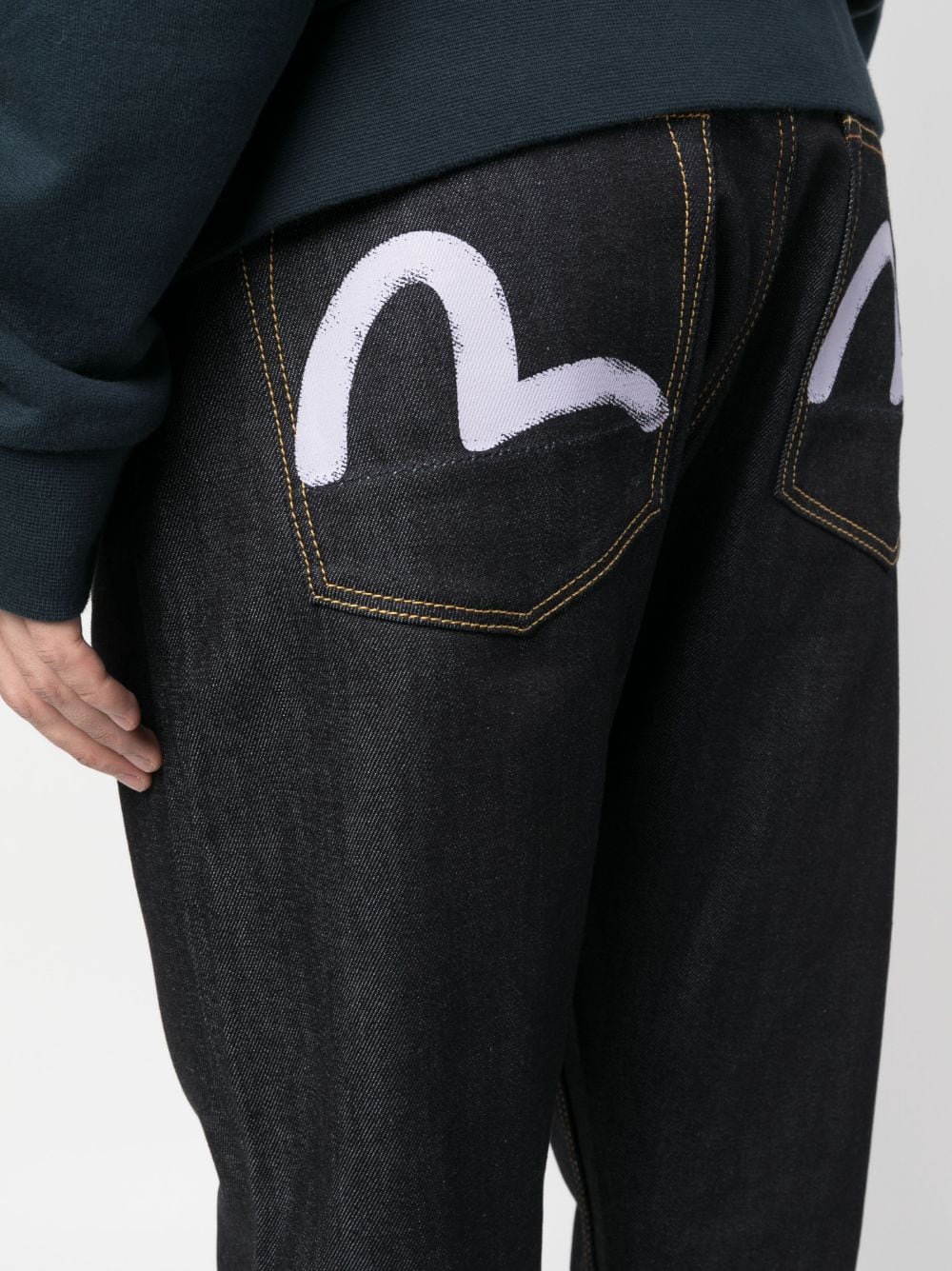 Shop Evisu Logo-print Tapered Jeans In Black