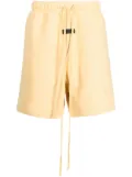 FEAR OF GOD ESSENTIALS logo-patch track shorts - Yellow