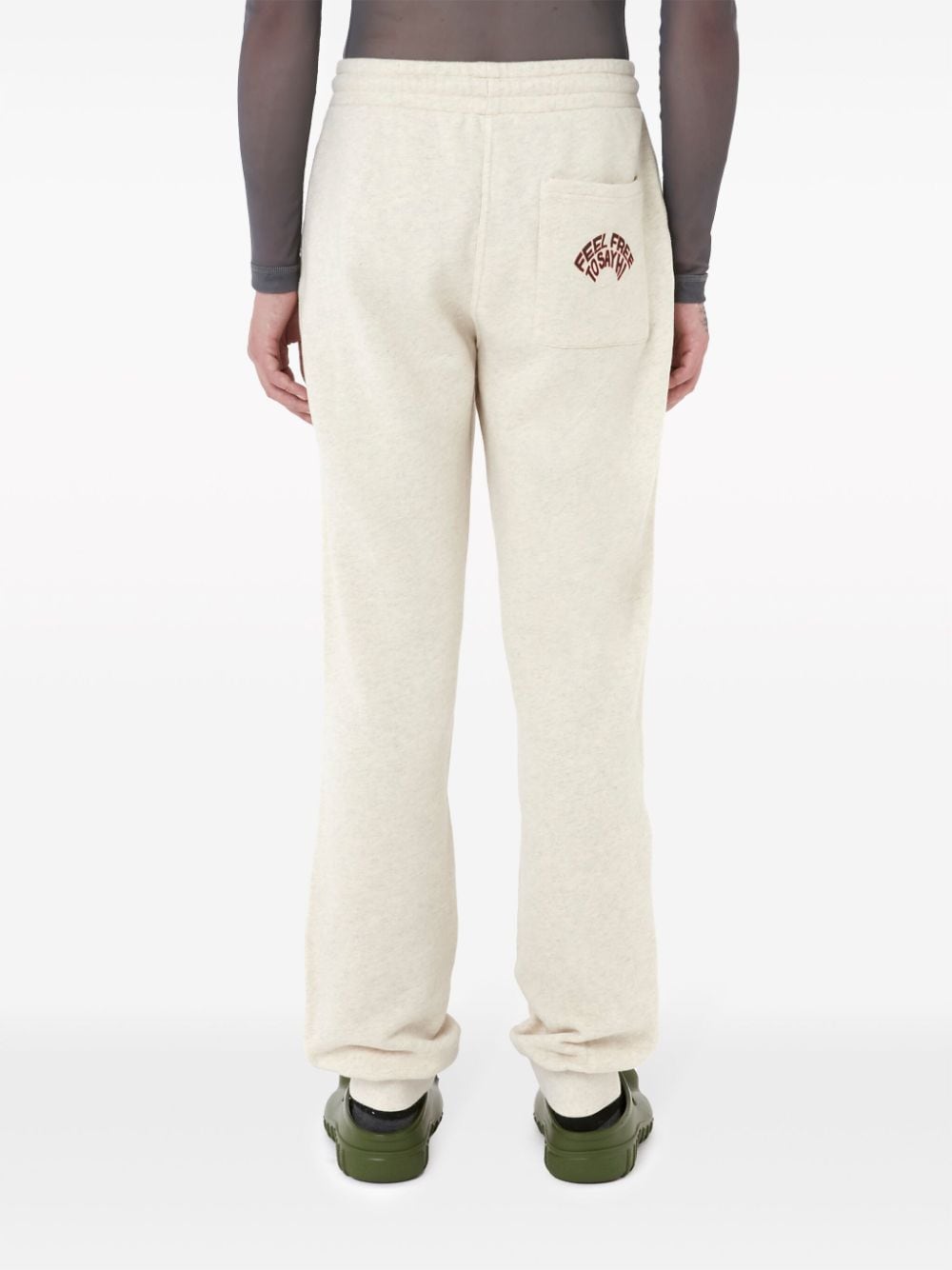 Shop Jw Anderson Slogan-embroidered Cotton Track Pants In White