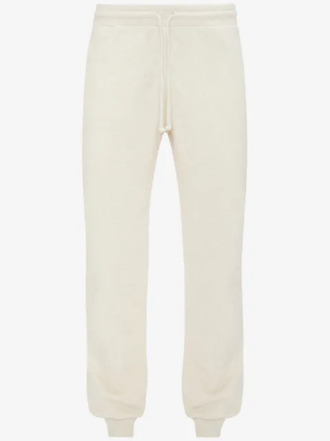 JW Anderson slogan-embroidered cotton track pants 