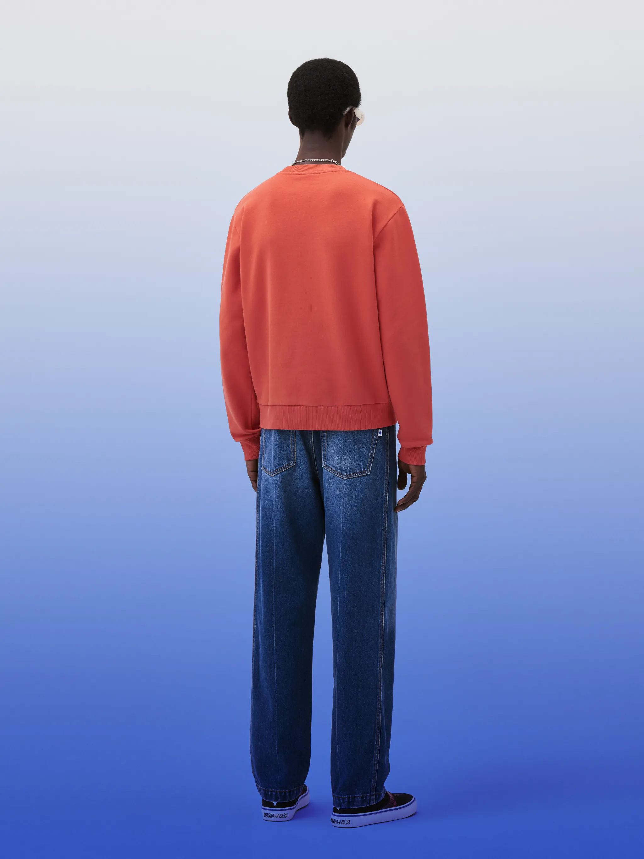 Cross cotton sweatshirt from Marcelo Burlon County of Milan featuring lava orange, cotton, signature Cross motif, ribbed trim, crew neck, long sleeves and straight hem.
