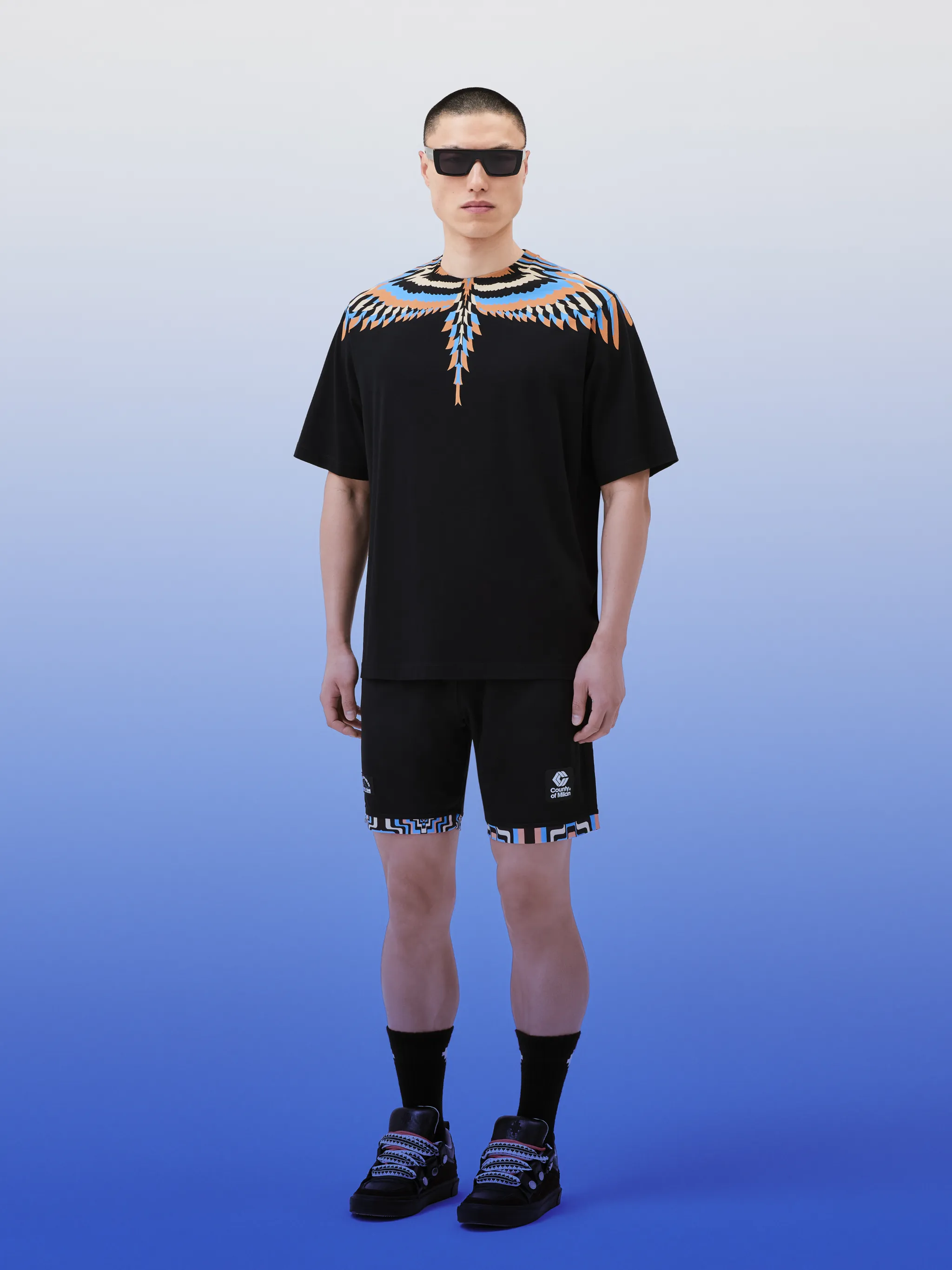 Optical Wings-print cotton T-shirt from Marcelo Burlon County of Milan featuring black/multicolour, cotton, signature Marcelo Burlon Wings print, crew neck and short sleeves.