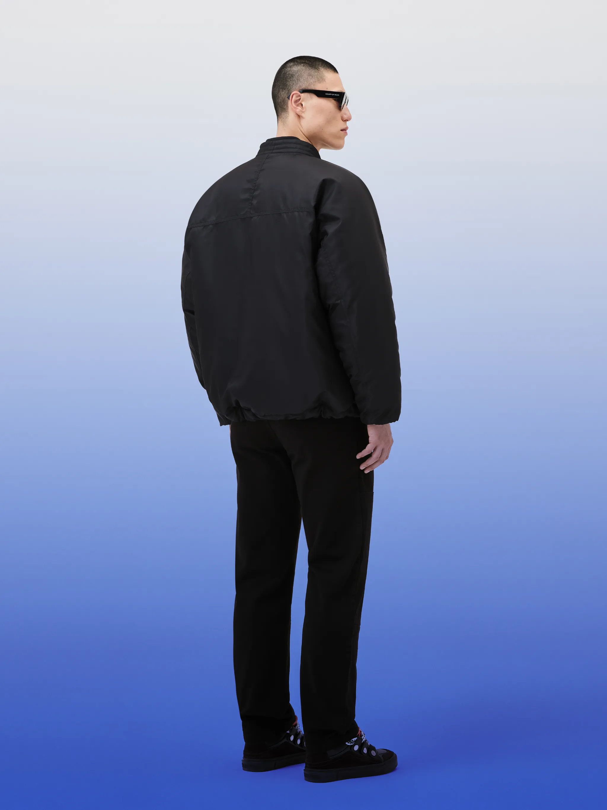 embroidered-logo lightweight bomber jacket from Marcelo Burlon County of Milan featuring black, embroidered logo at the chest, collarless, concealed front fastening, long sleeves, sleeve zip pocket, two side welt pockets and straight hem.