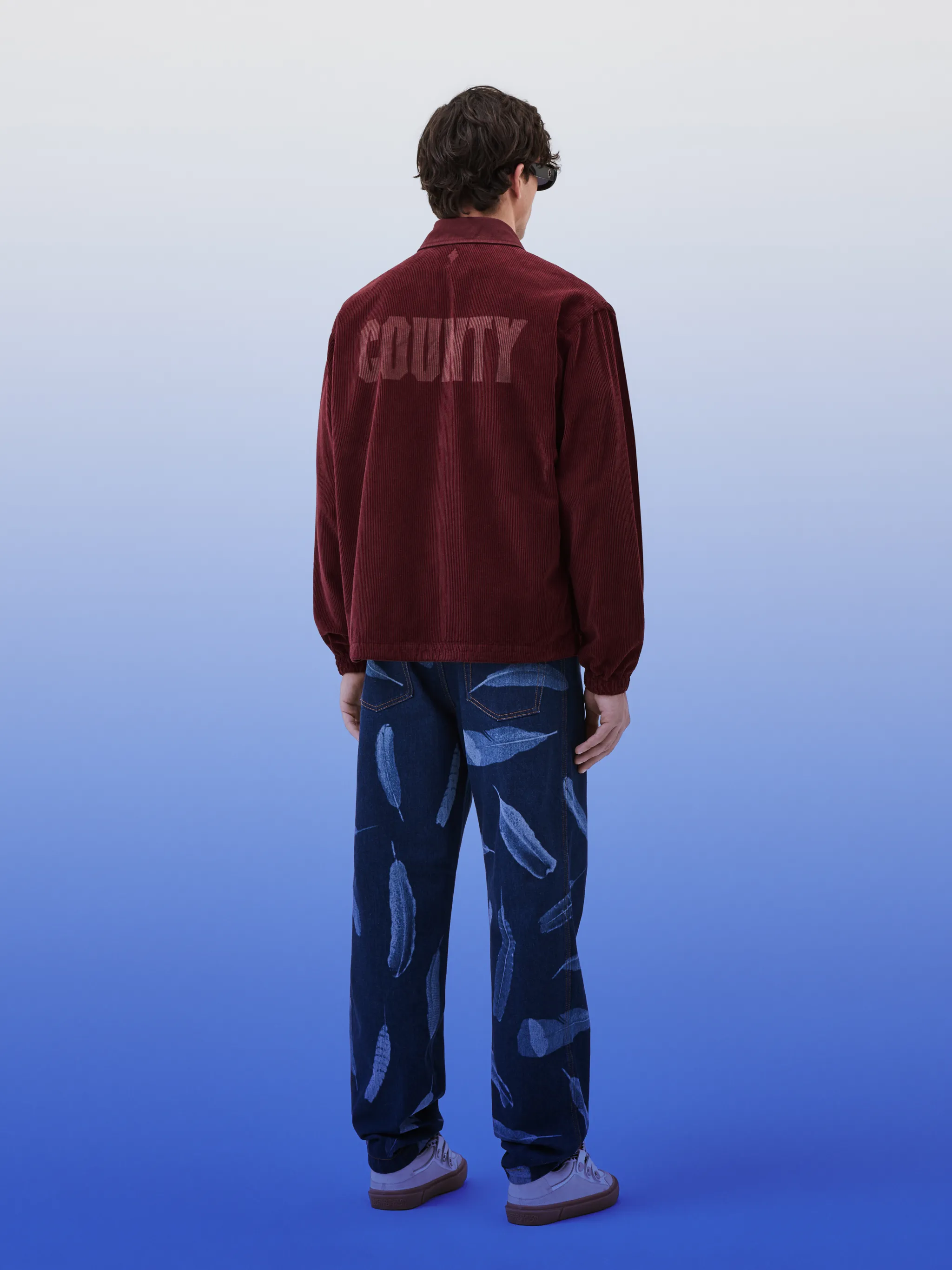 County Label corduroy jacket from Marcelo Burlon County of Milan featuring clay red, cotton, corduroy, logo print to the rear, logo patch to the front, classic collar, front zip fastening, long sleeves, two diagonal pockets to the sides and drawstring hem.