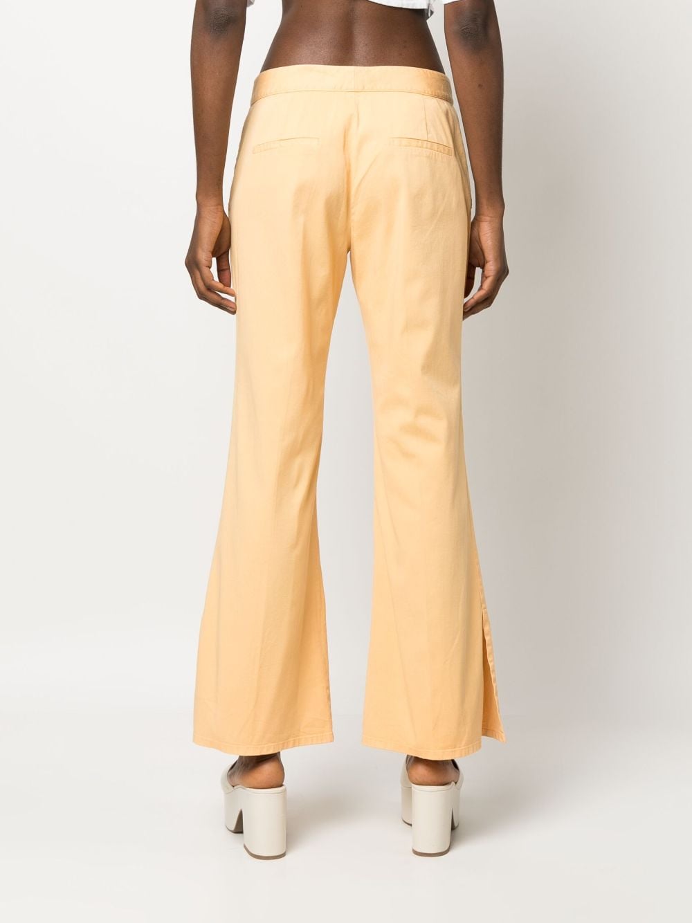 Shop Callas Milano Sofia Low-rise Flared Trousers In Yellow