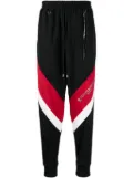 Mastermind World logo-print stripe-detailing track pants - Black