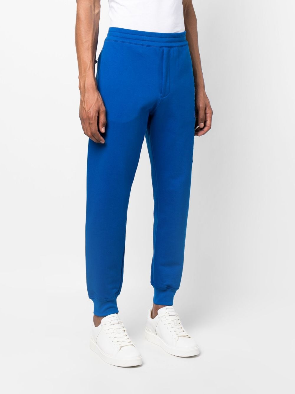 Shop Alexander Mcqueen Embroidered-logo Track Pants In Blue