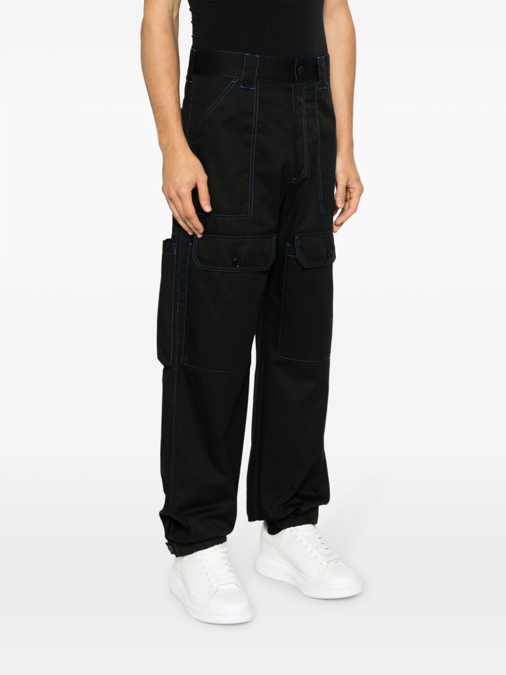 Shop Msgm Contrasting-stitch Logo-patch Trousers In Black