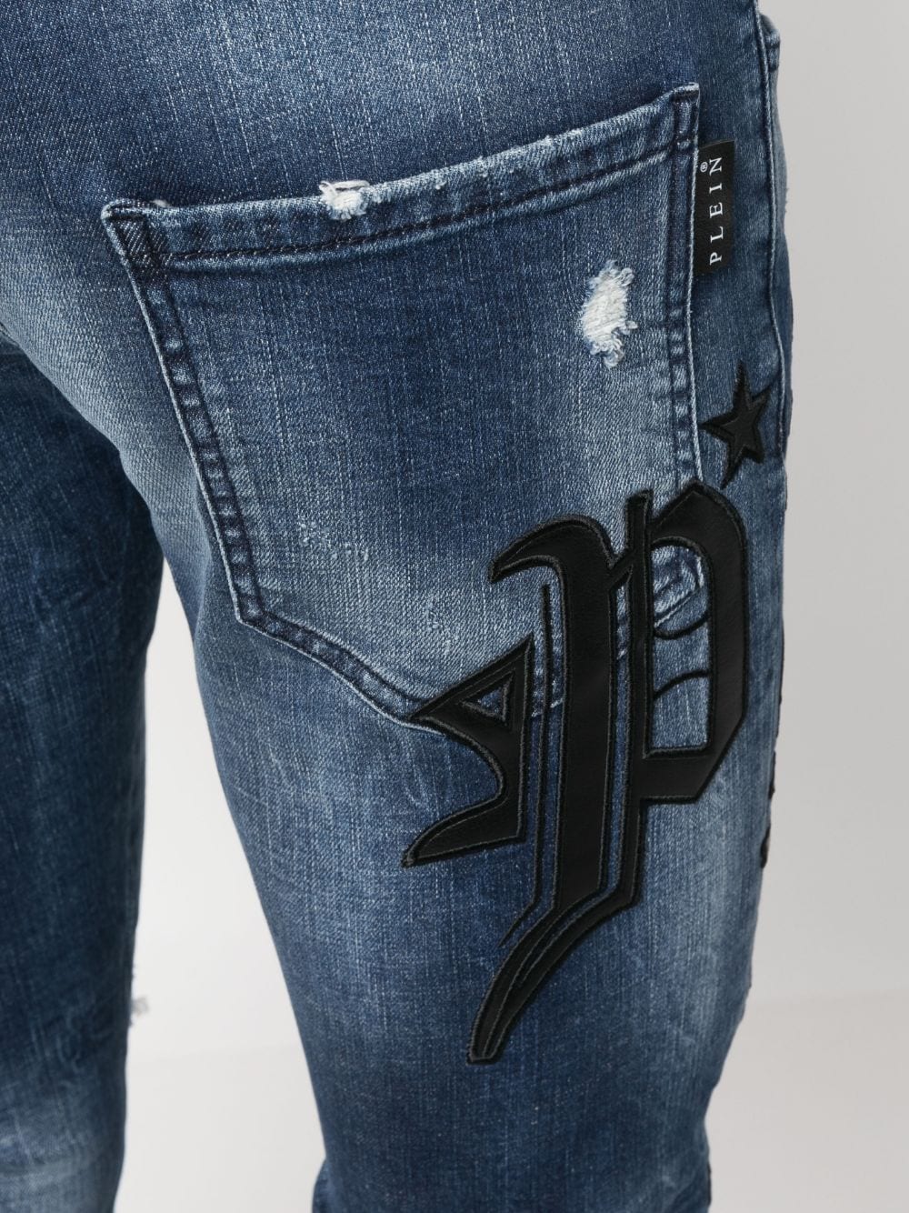 Shop Philipp Plein Skull & Bones Logo-embroidered Ripped Jeans In Blue