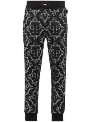 Sacai x Hank Willis Thomas Patchwork Trousers | Black | FARFETCH
