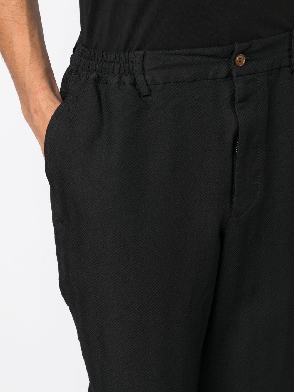 Black Comme Des Garcons chevron-pattern tapered trousers Men