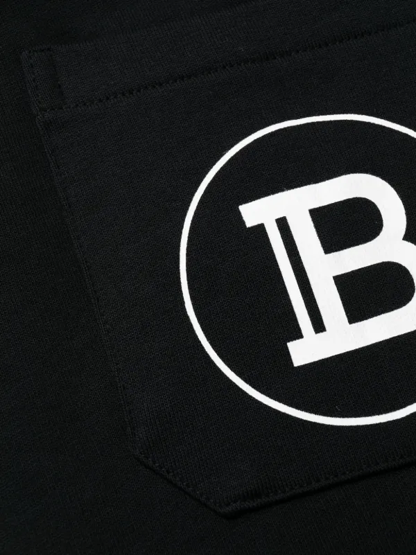 【国内即発】BALMAIN ロゴトラックパンツ ホワイト／ブラック BALMAIN - サイドラインエモーションロゴ ジョガーパンツ