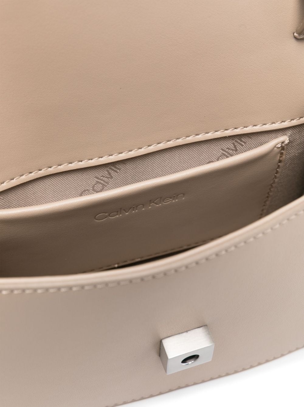 Shop Calvin Klein Logo-plaque Faux Leather Crossbody Bag In Neutrals