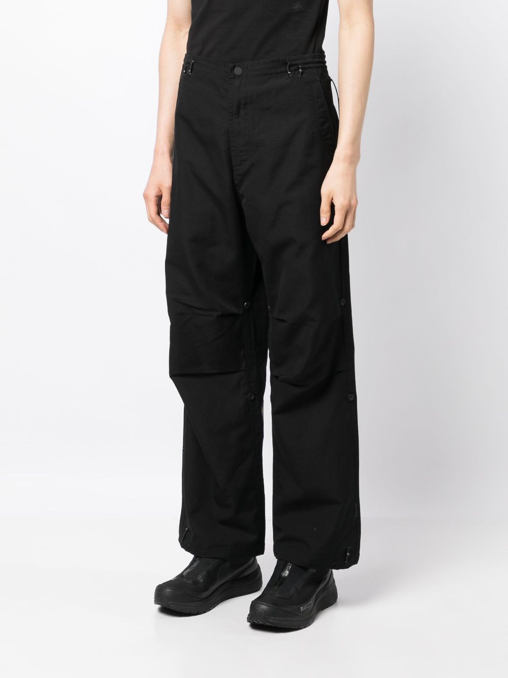 Shop Maharishi Rabbit-embroidered Lose-fit Trousers In Black