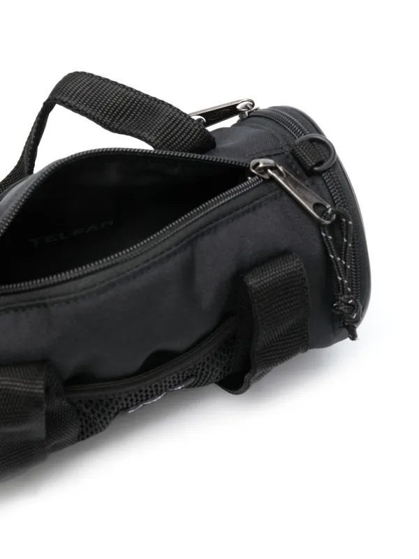 Eastpak x Telfar debossed-logo Messenger Bag | Black | FARFETCH