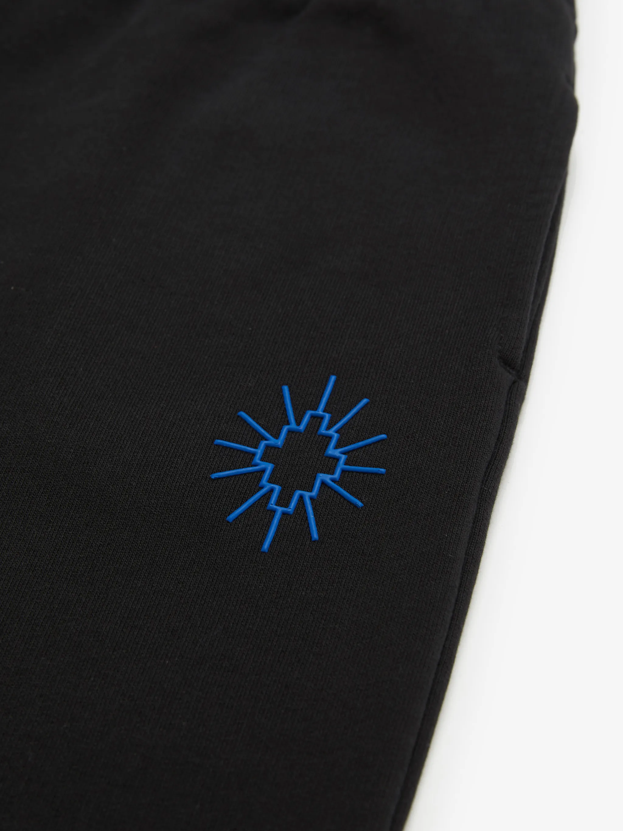 logo-embroidered cotton track trousers from Marcelo Burlon Kids featuring black, cotton, embroidered logo, elasticated waistband and elasticated ankles.