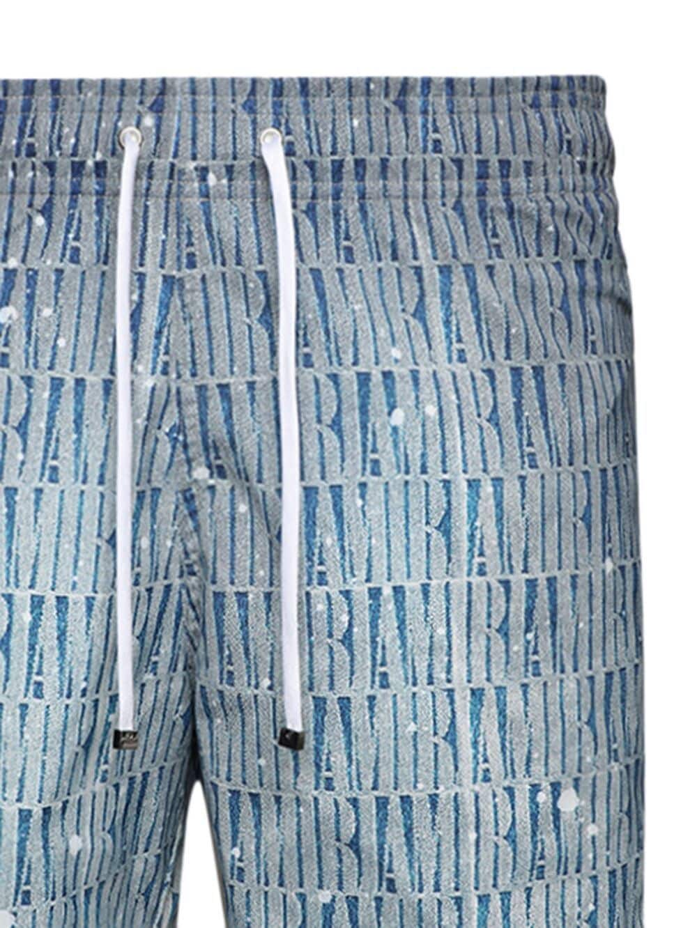 Shop Amiri Logo-print Gradient-effect Swim Shorts In Blue