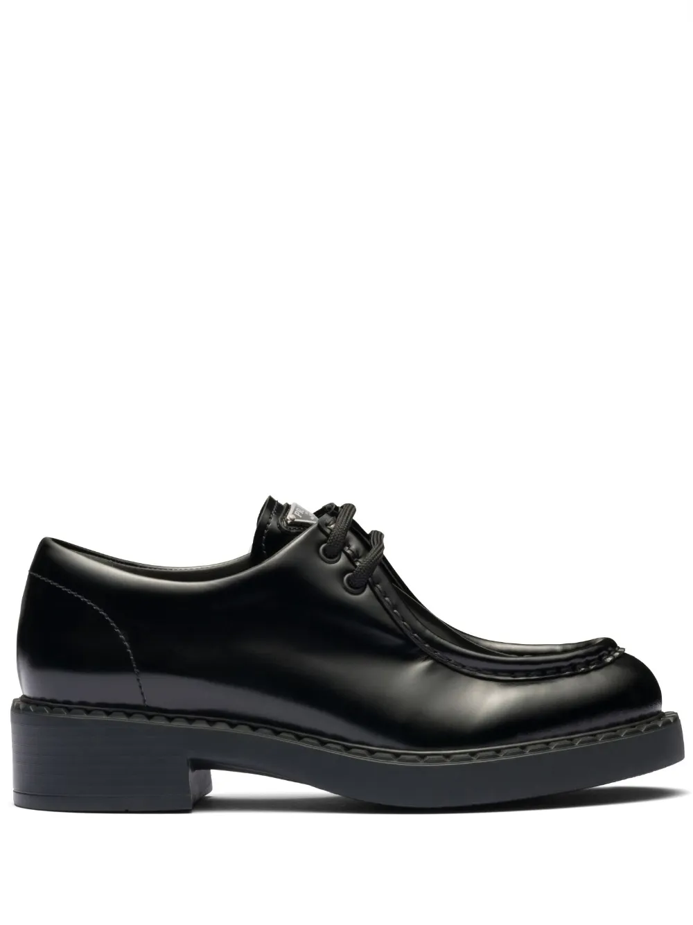 Shop Prada Brushed Leather Lace-up Shoes In Black