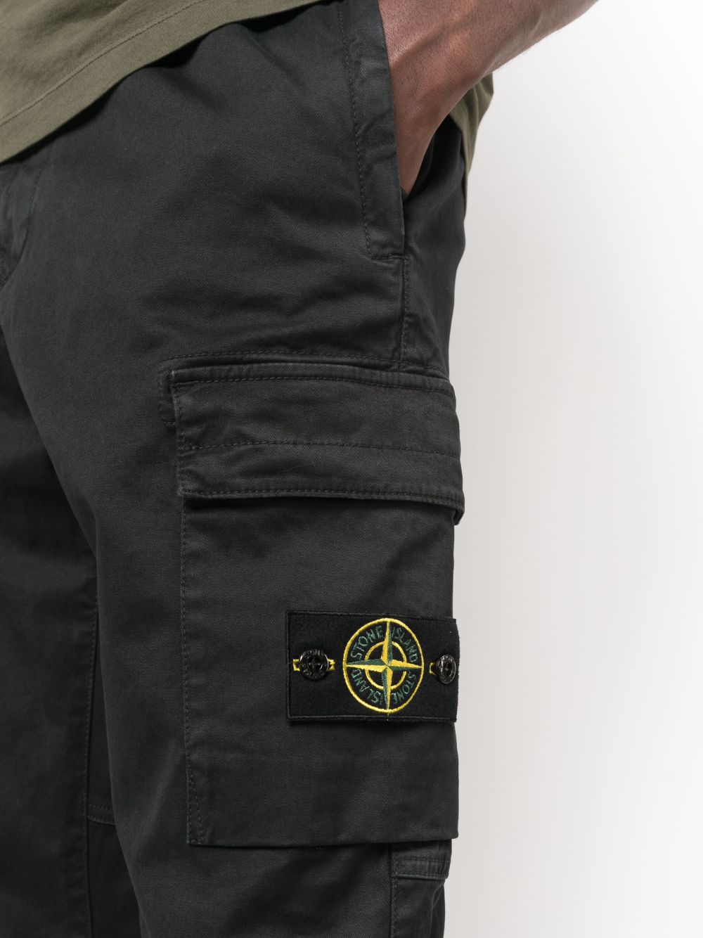 Shop Stone Island Tapered-leg Cargo Trousers In Black