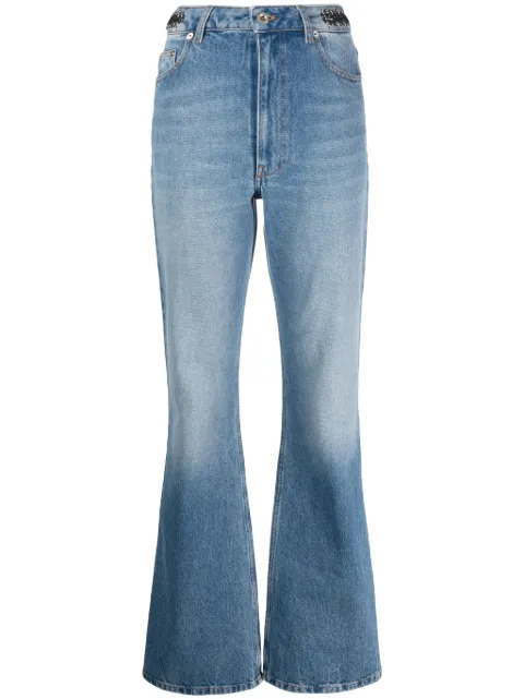 Rabanne jeans acampanados con detalle de monedas