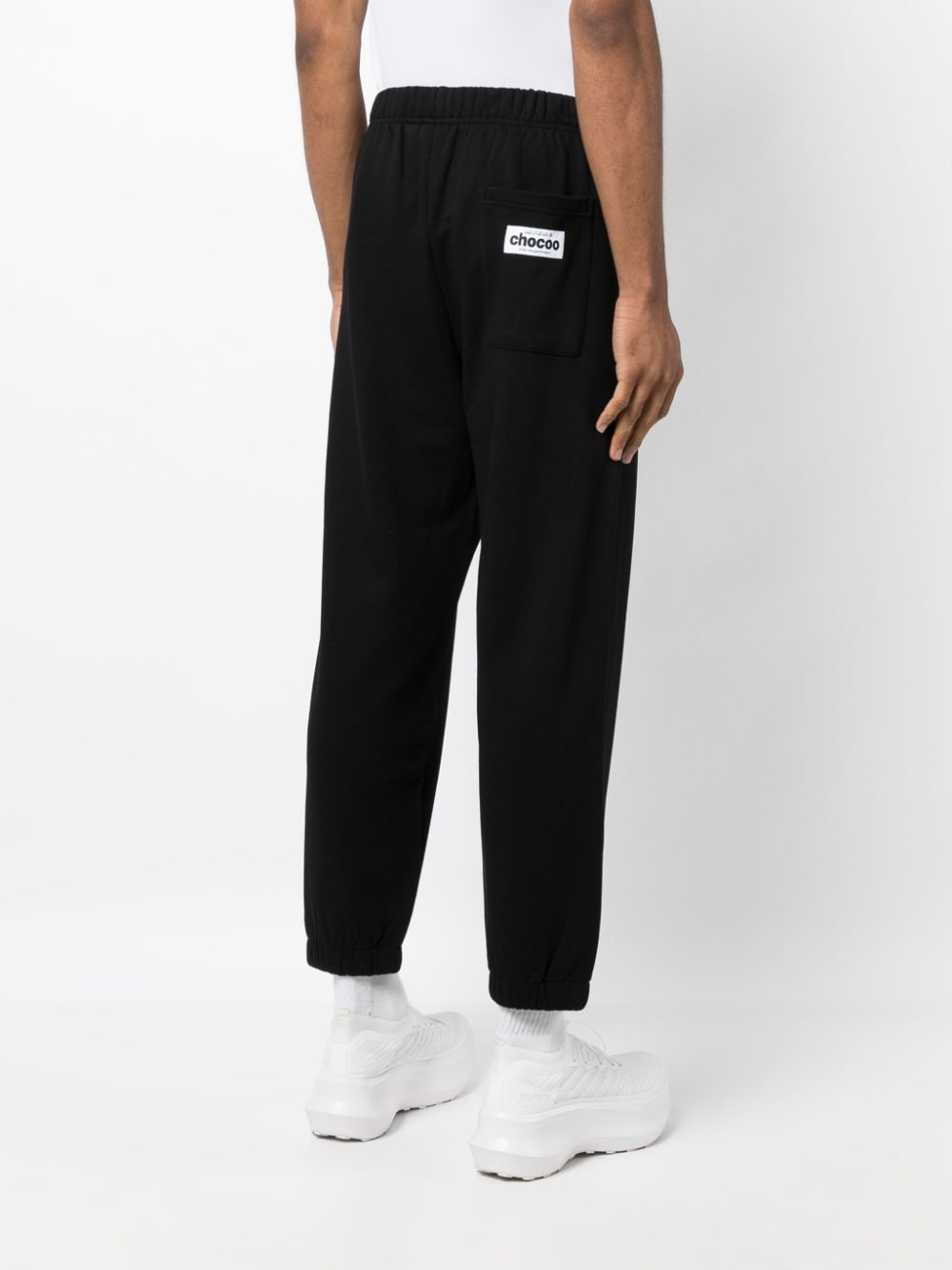 Shop Chocoolate Logo-print Cotton Track Pants In Black