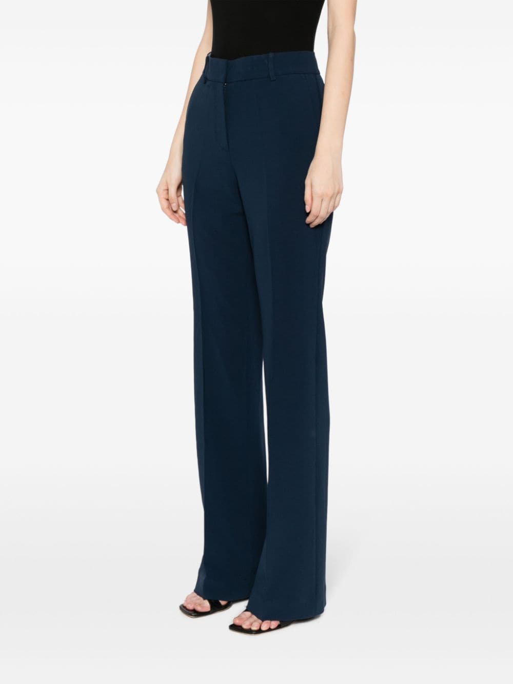 Shop Michael Kors Pressed-crease Flared Trousers In Blue