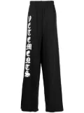 VETEMENTS logo-print cotton track pants - Black