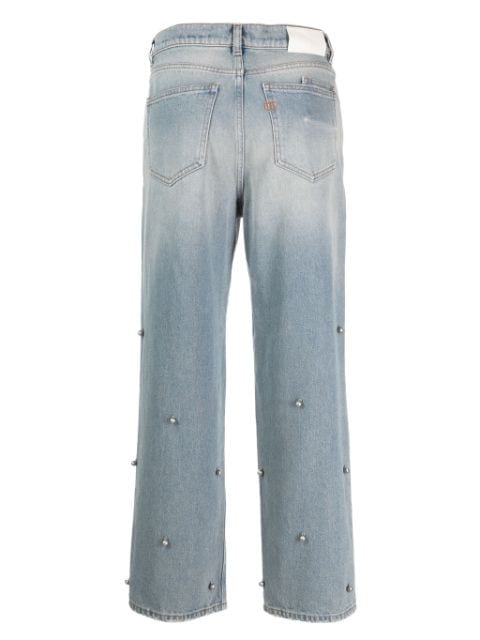 bell-emgellished indigo-wash jeans