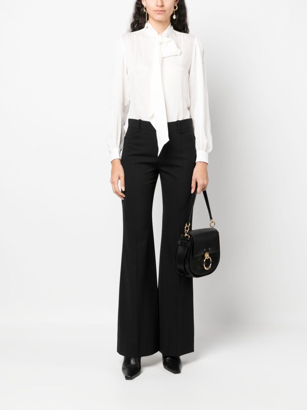 Shop Chloé Low-rise Flared Trousers In Black