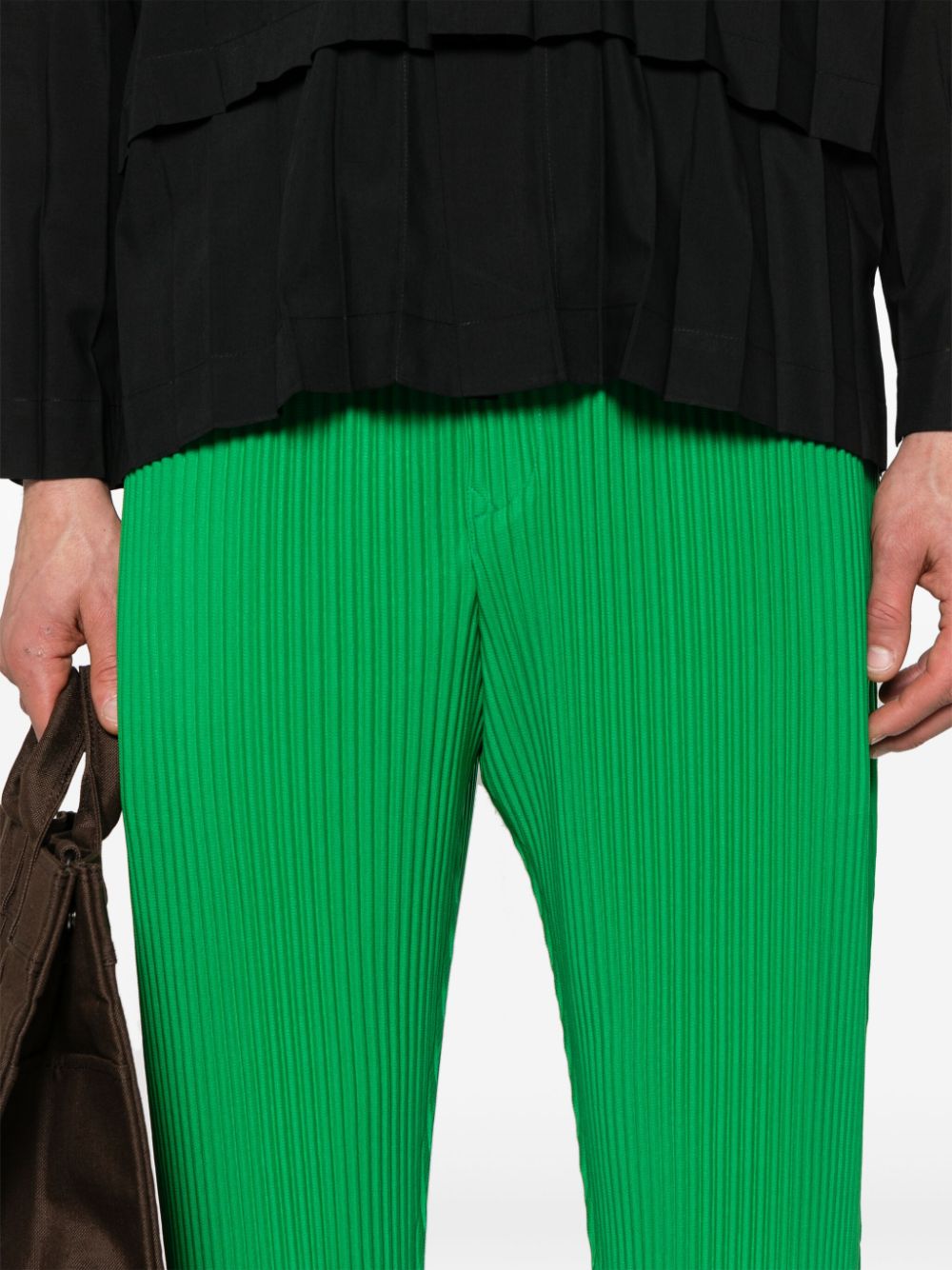 Shop Issey Miyake Pleated Tapered Trousers In 绿色