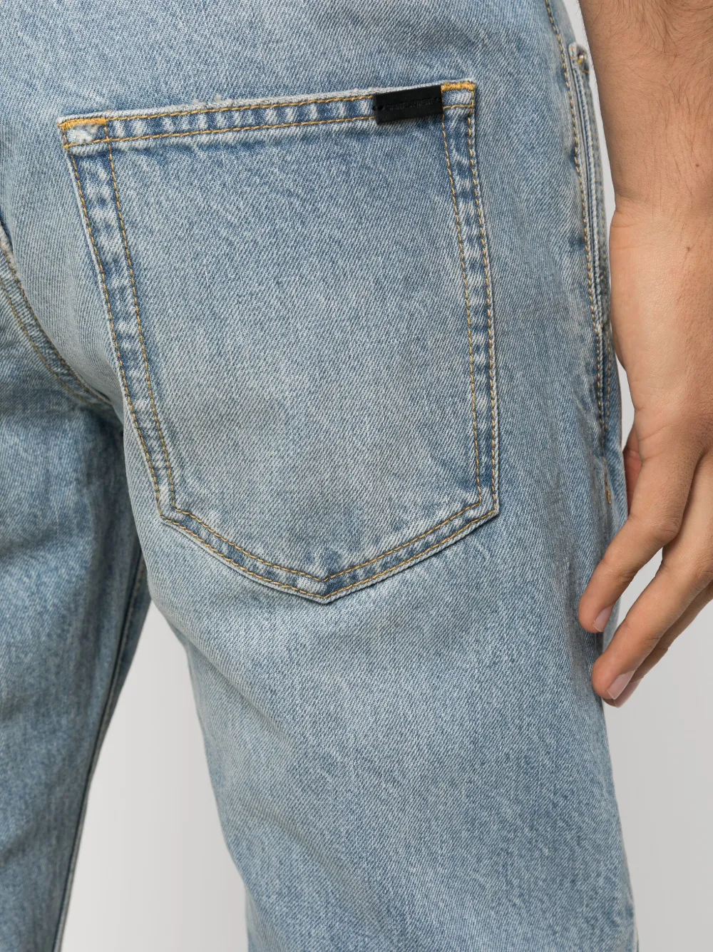 Saint Laurent logo-plaque slim-cut Jeans - Farfetch