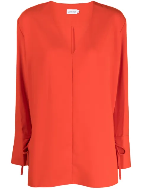 Calvin Klein blusa con lazo en los puños