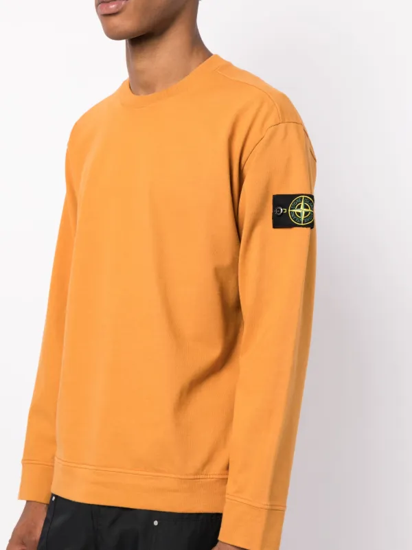 Felpa arancione hot sale stone island