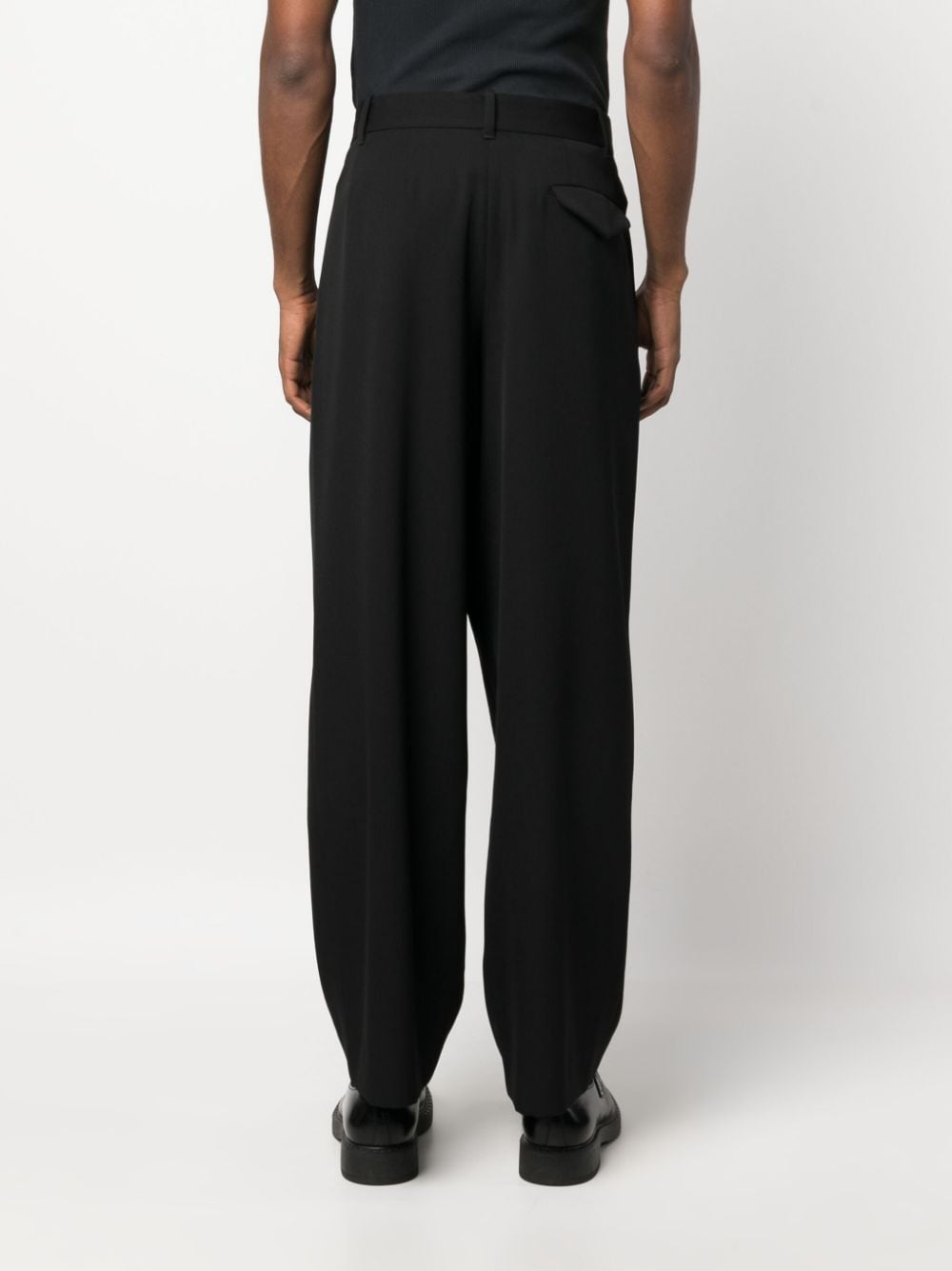 Shop The Row Pleated Wide-leg Wool Trousers In Black