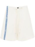 JW Anderson logo-tape wide-leg shorts - White