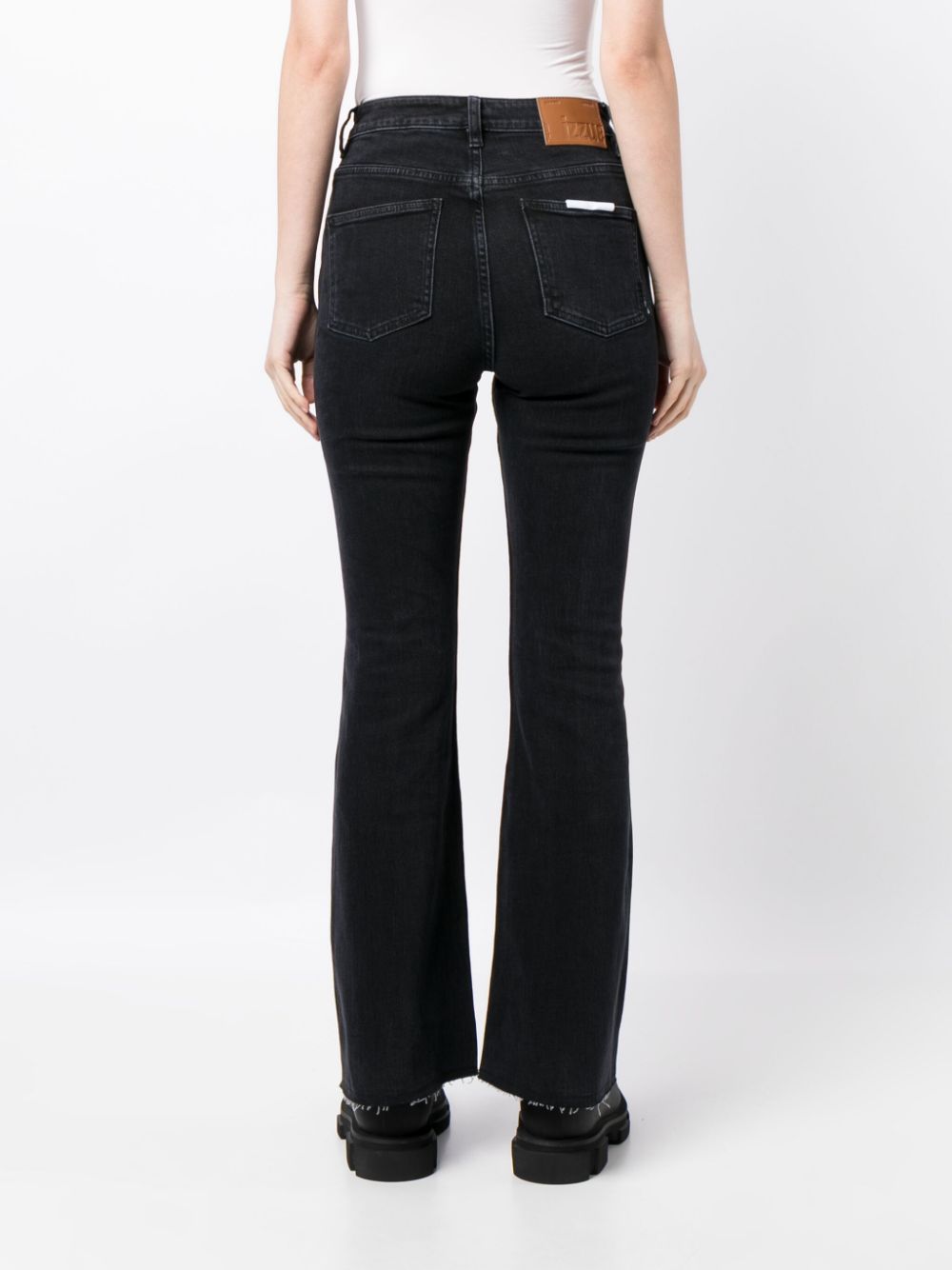 Shop Izzue High-rise Flared Jeans In 黑色