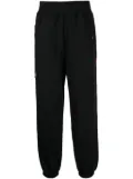 izzue logo-patch track pants - Black