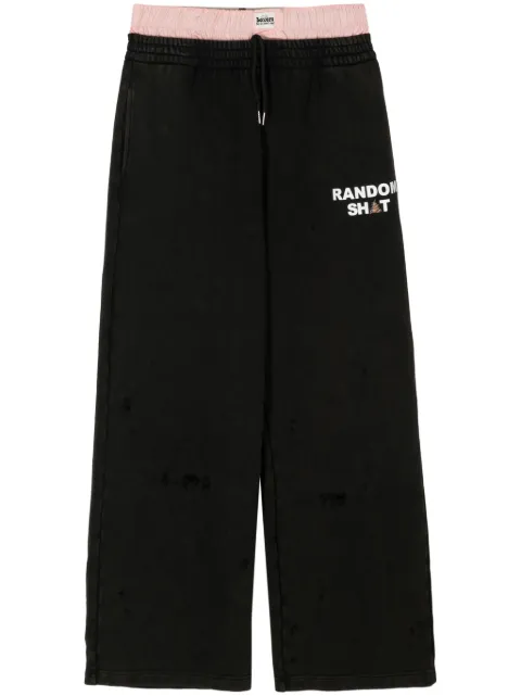 Natasha Zinko pantalones a capas con logo estampado