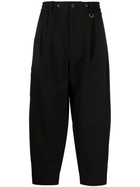 SONGZIO logo-embroidered pleated drop-crotch trousers