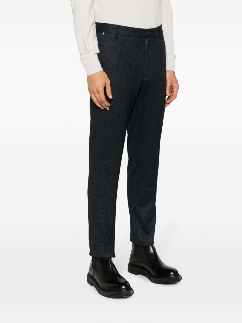 Shop Hugo Boss Logo-patch Tapered Trousers In Schwarz