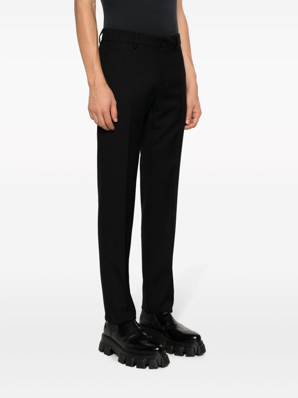Shop Versace Slim-cut Wool Trousers In Black