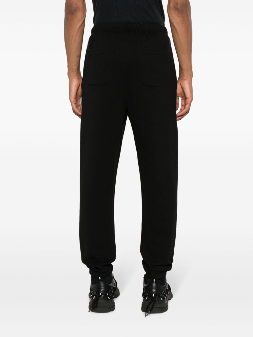 Shop Ih Nom Uh Nit Logo-print Cotton Sweatpants In Black