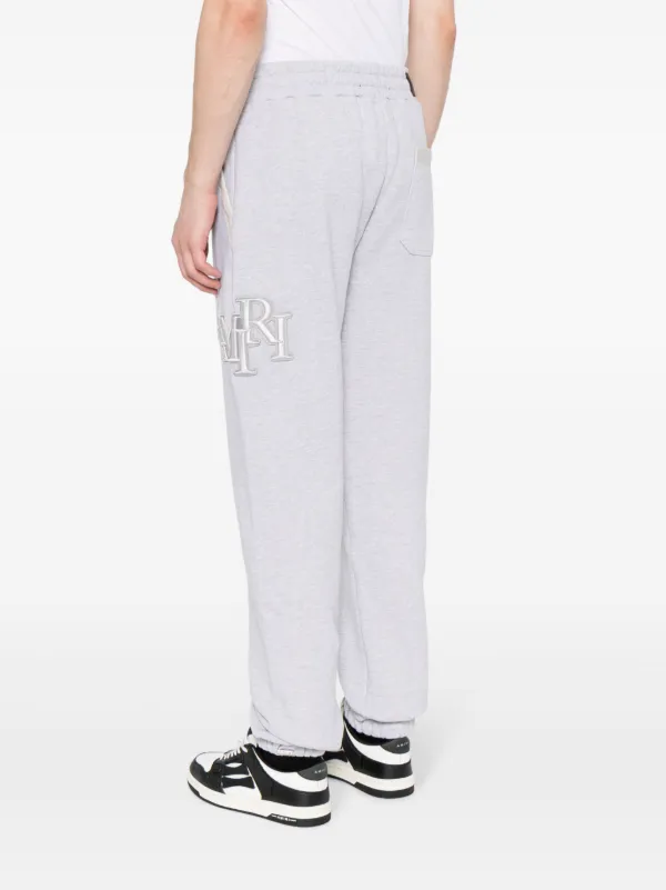 パンツ Amiri Trousers AMIRI Staggered logo-embroidered Track Pants | Grey | FARFETCH