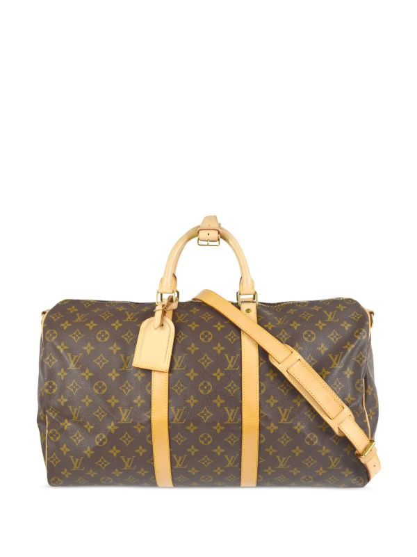 A Louis Vuitton shoe bag, the monogram canvas body with tan leather  trimming and handles, length 54c