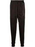 Mastermind World logo-jacquard tapered track pants - Brown
