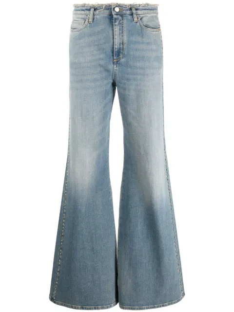 Dorothee Schumacher jeans bootcut con detalles deshilachados y apliques