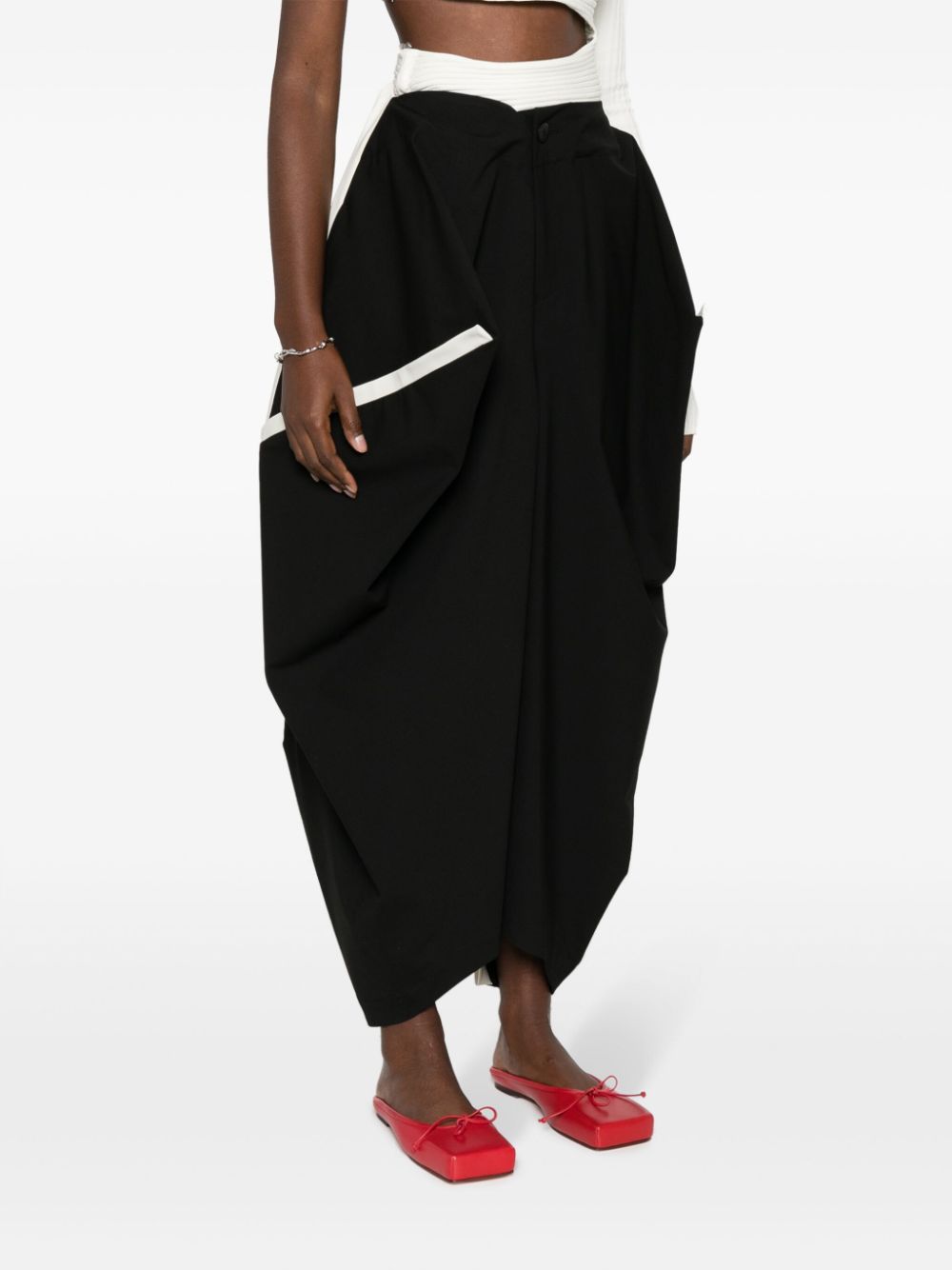 Shop Issey Miyake Assembled Contrast-trim Tapered Trousers In Black