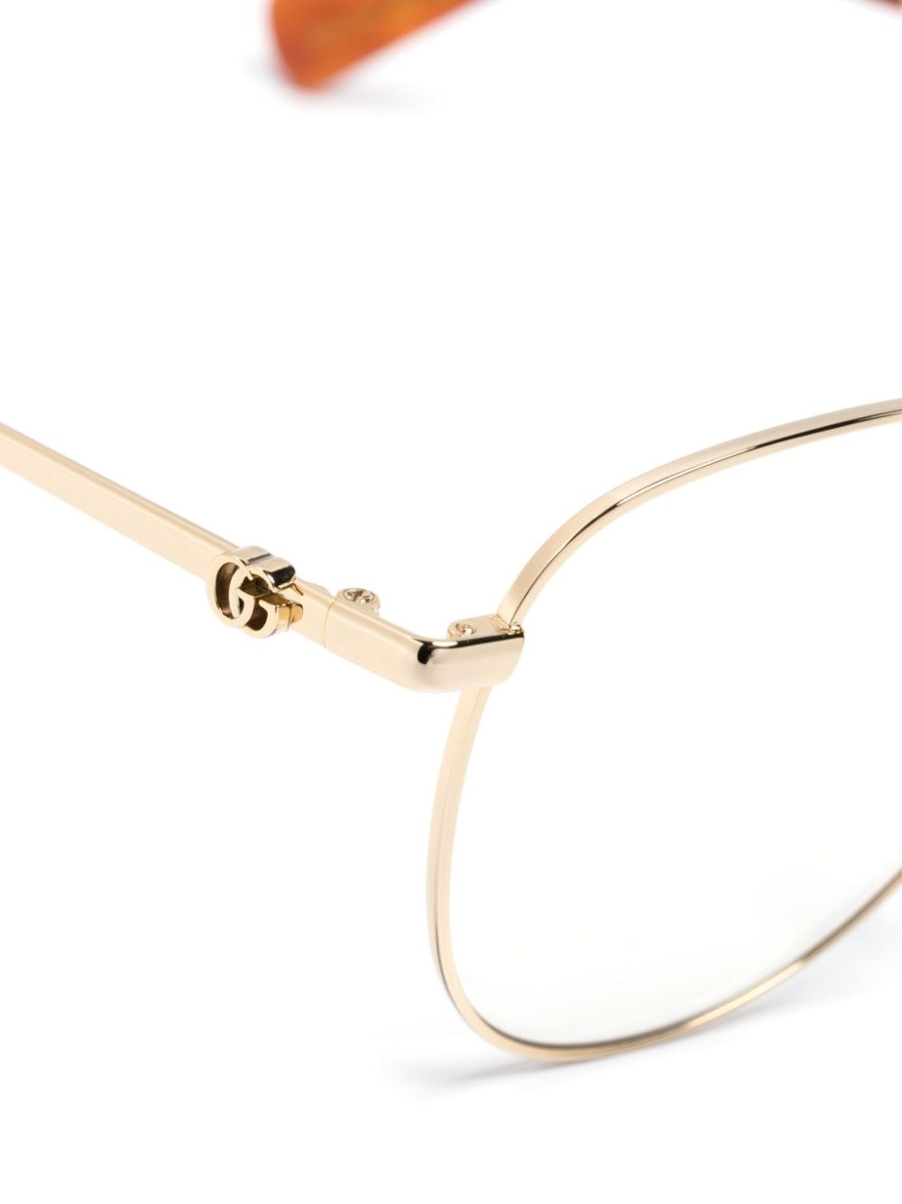 Shop Gucci Double G Logo-engraved Cat-eye Frame Glasses In Gold